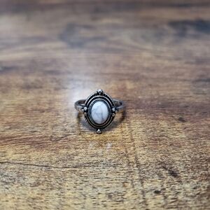 Silver tone ring with white stone size 5.5
